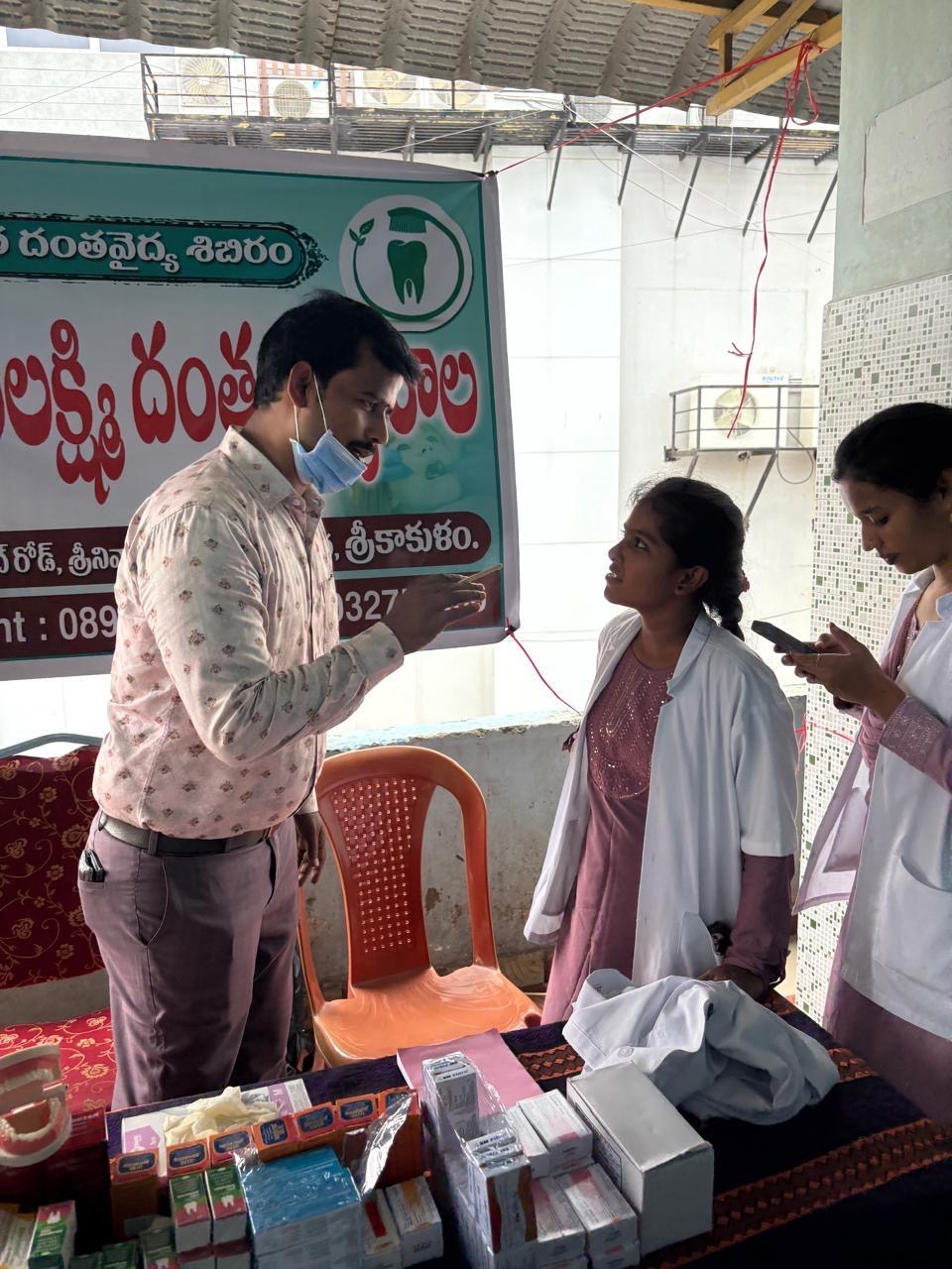 Clinic medical assistants assisting patient flow at the camp