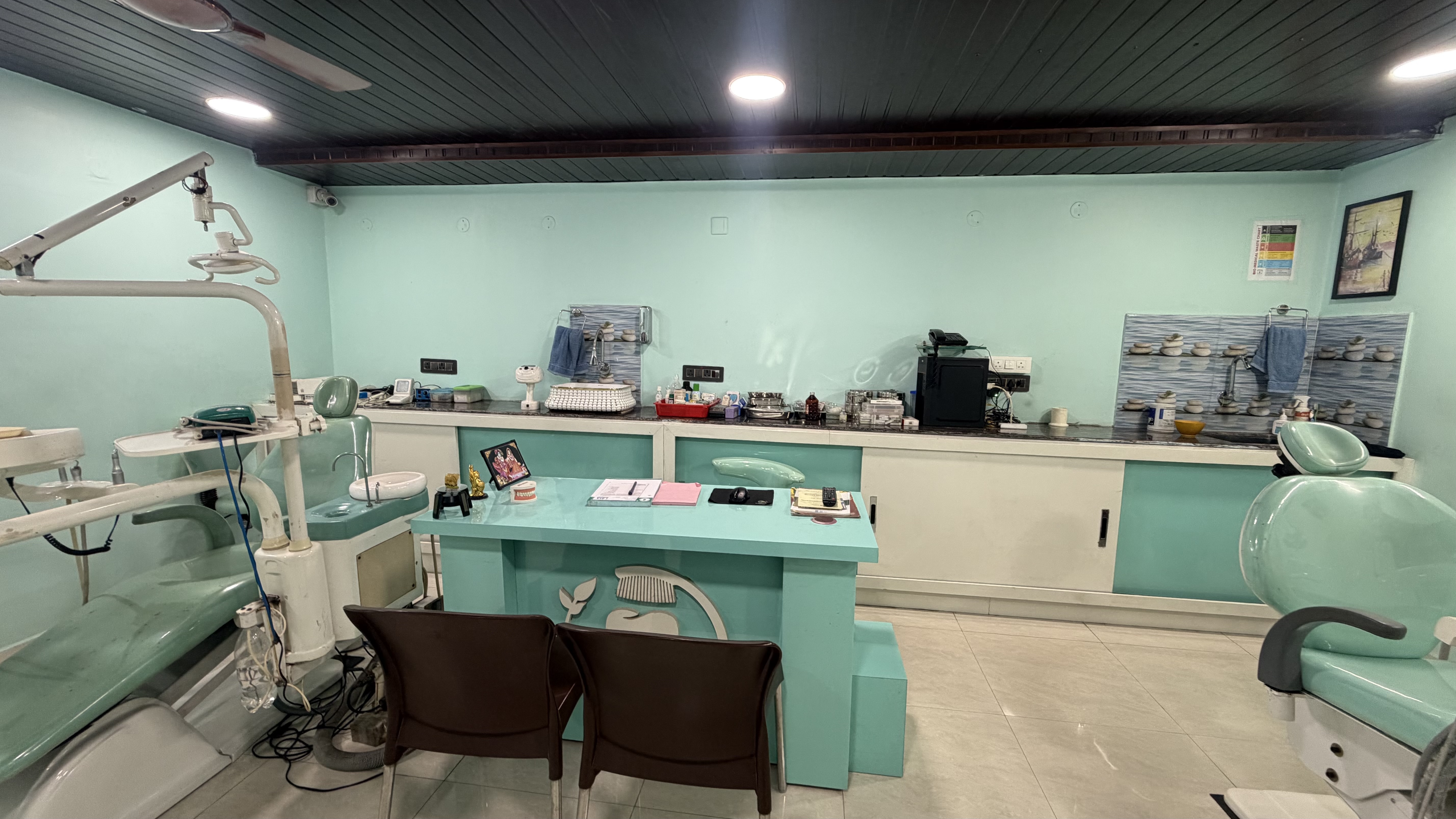 Doctor Consultation desk and checkup station at Dhanalakshmi Dental Clinic